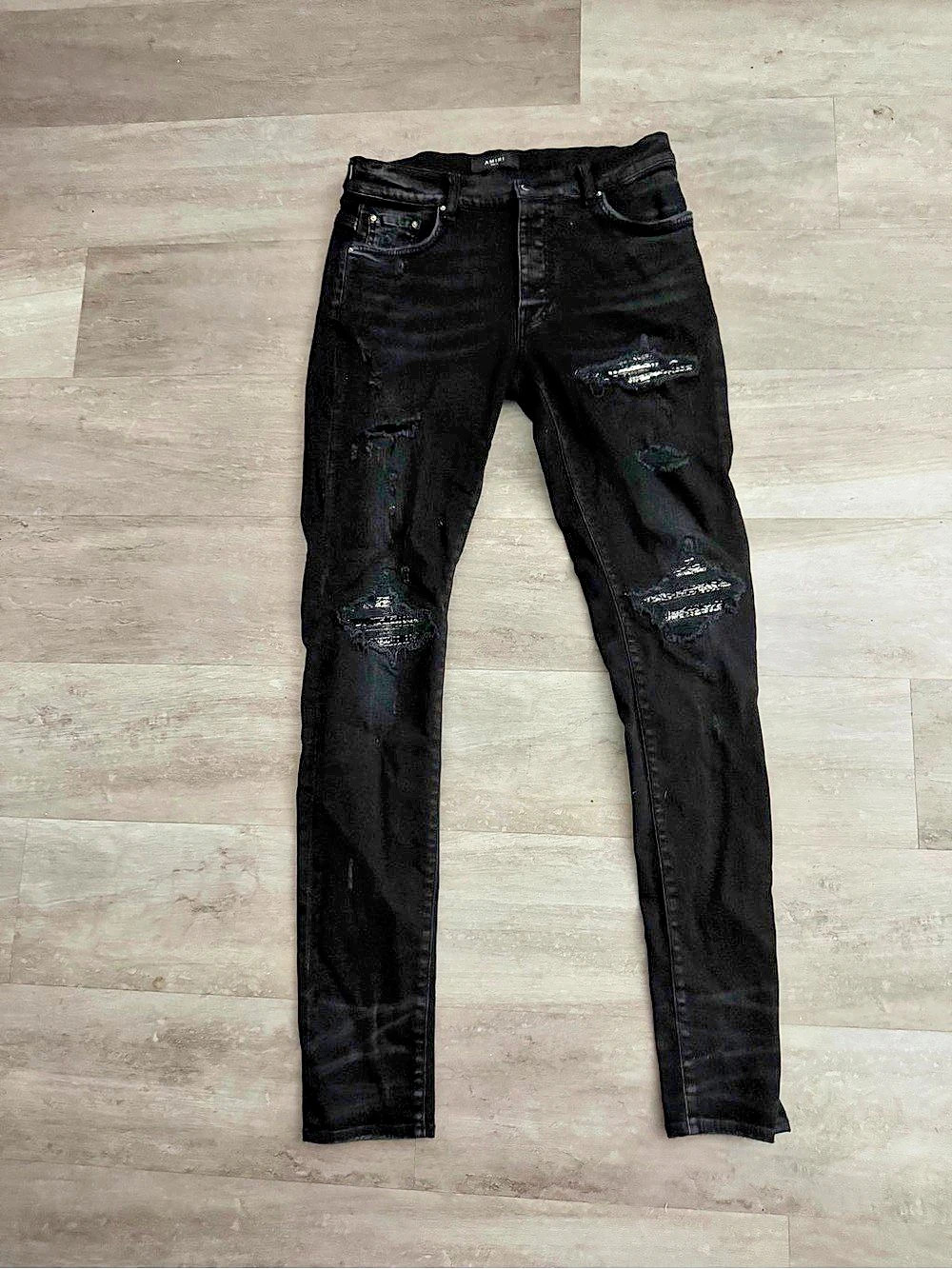 AMIRI MX1 Distressed Skinny Jeans Distressed Skinny Jeans in Black